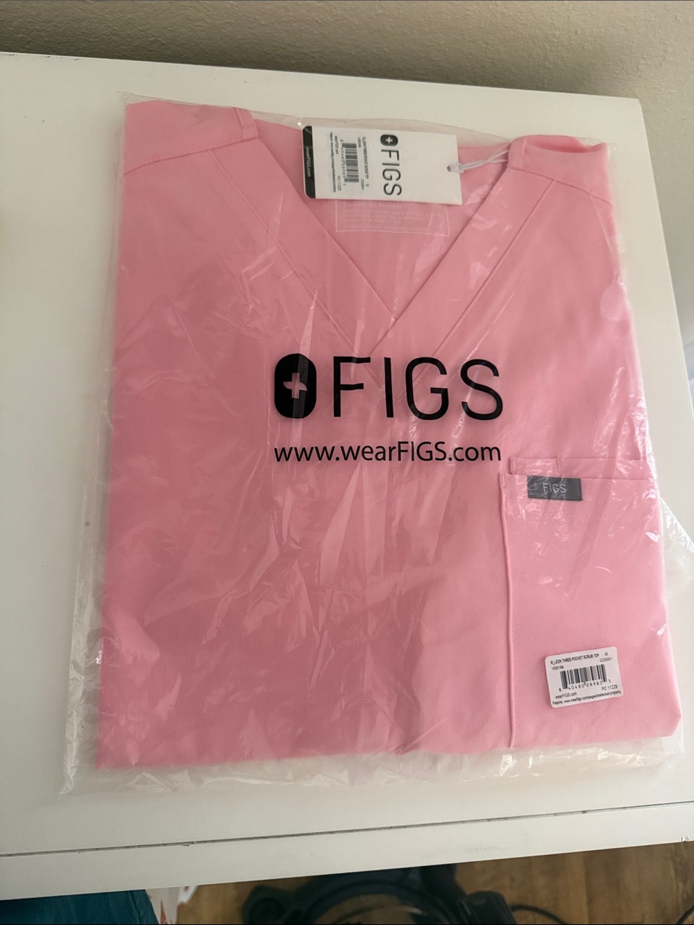 Leon three pocket scrub top in color pink